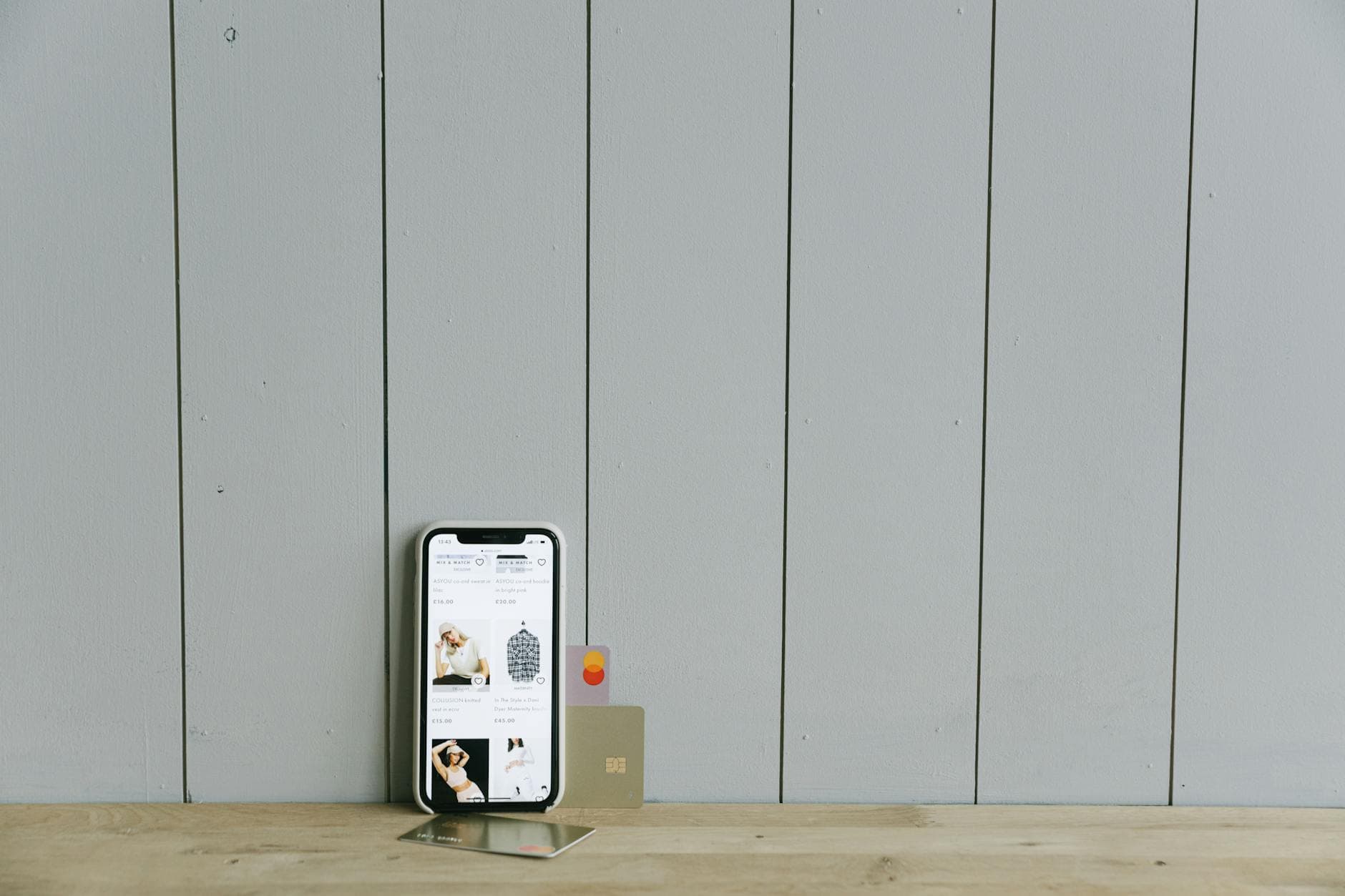 Smartphone displaying a mobile payment app on a wooden surface