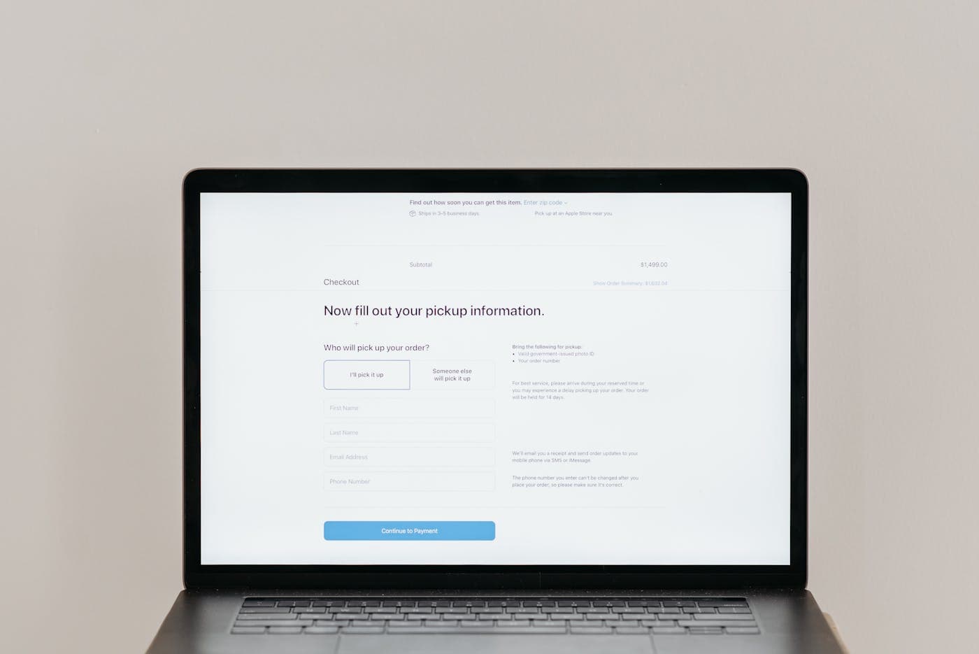 Customer completing an online payment on a laptop