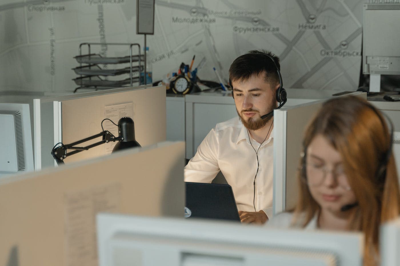 Contact centre agent wearing a headset taking a phone payment