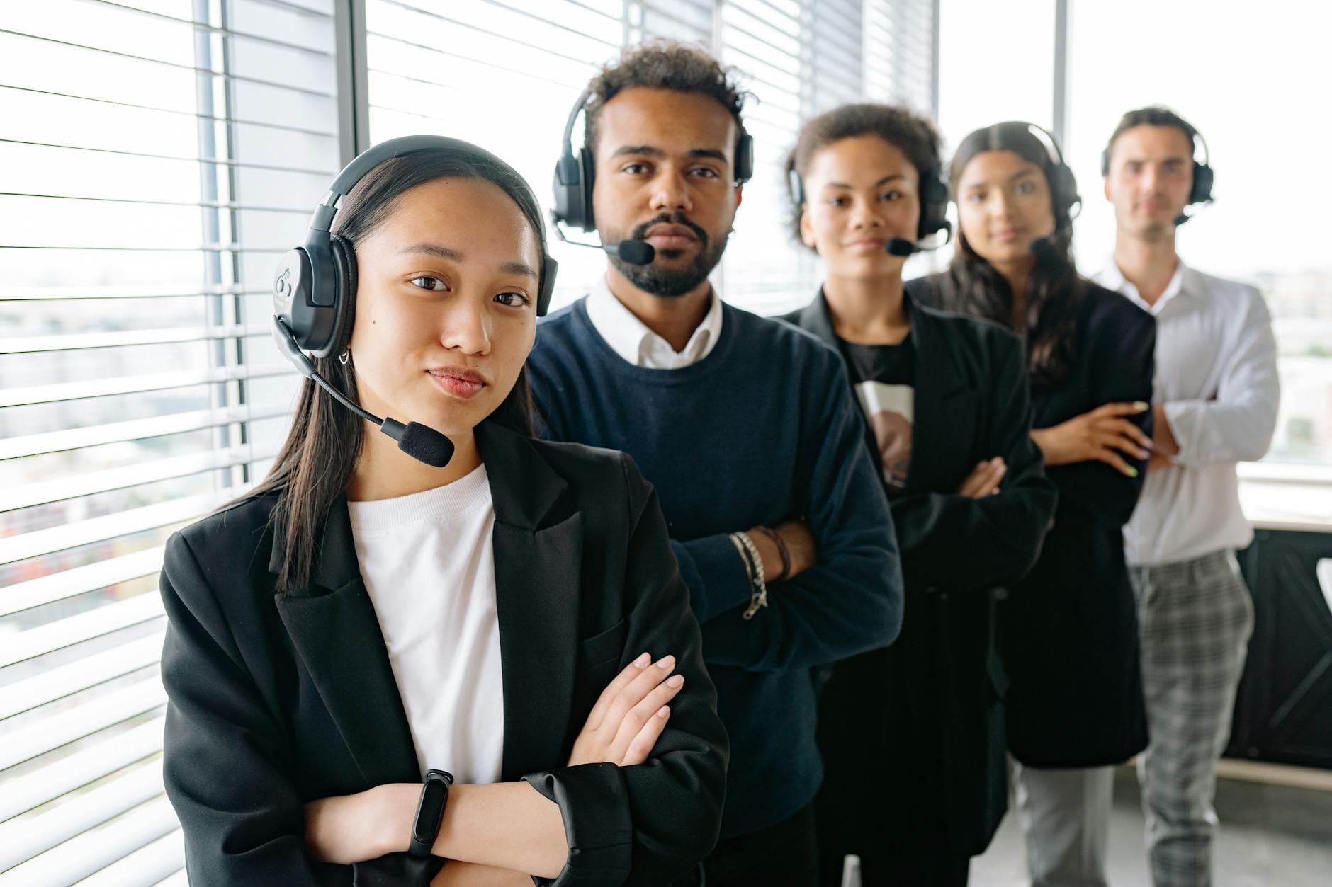 Contact-centre agents wearing headsets in a modern office