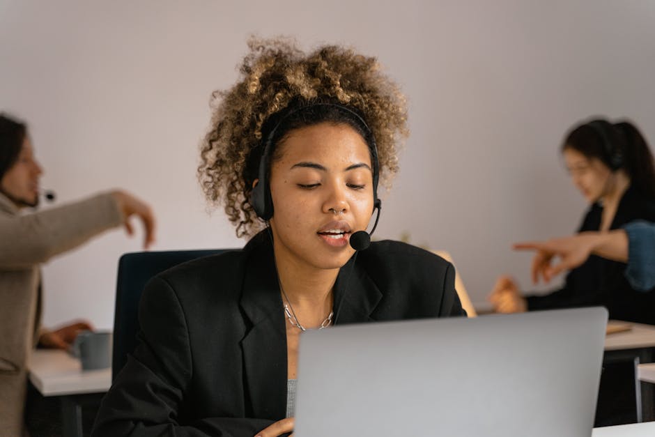 Contact center agent wearing a headset running outbound payment calls